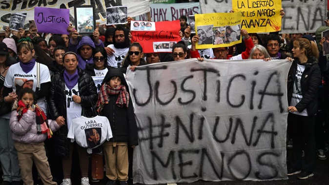 Relatives and friends attend a demonstration called by rights groups under the banner: "There are no good or bad victims, only femicides". Photo / Luis Robayo, AFP