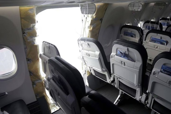 A gaping hole where the panelled-over door had been at the fuselage plug area of Alaska Airlines Flight 1282. Photo / AP