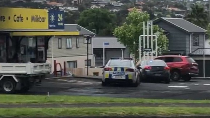The fleeing vehicle was rammed by two police vehicles yesterday afternoon at a West Auckland petrol station. (Photo / Simon Baker)