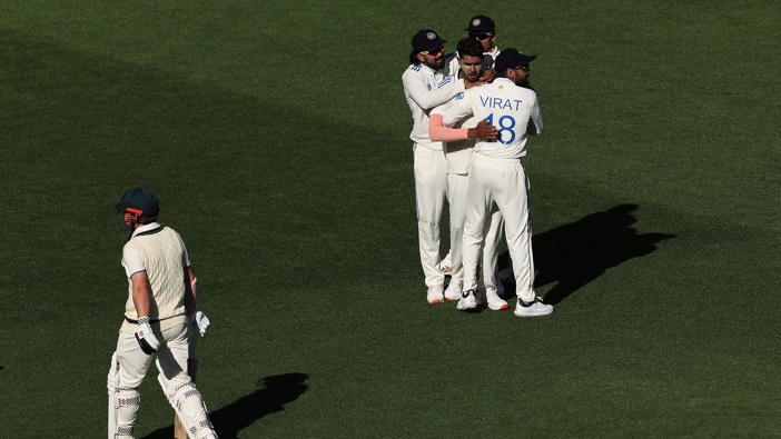 Harshit Rana of India celebrates the wicket of Travis Head of Australia during day one of the First Test match in the series between Australia and India at Perth Stadium on November 22, 2024 in Perth, Australia. (Photo by Paul Kane - CA/Cricket Australia via Getty Images)