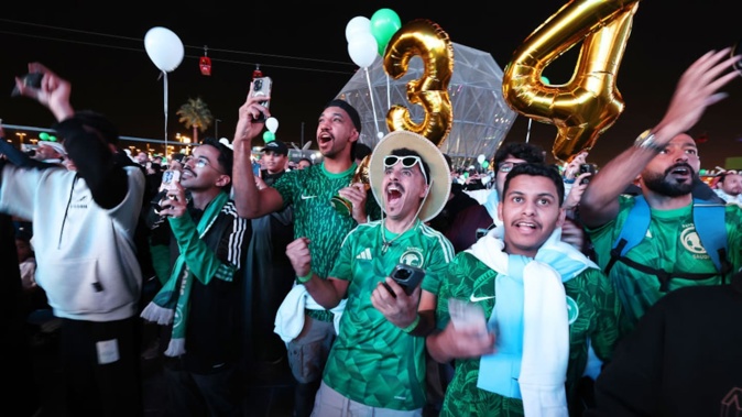 Fans celebrate as Saudi Arabia is announced as the host nation for the Fifa World Cup 2034 host. Photo / Getty Images