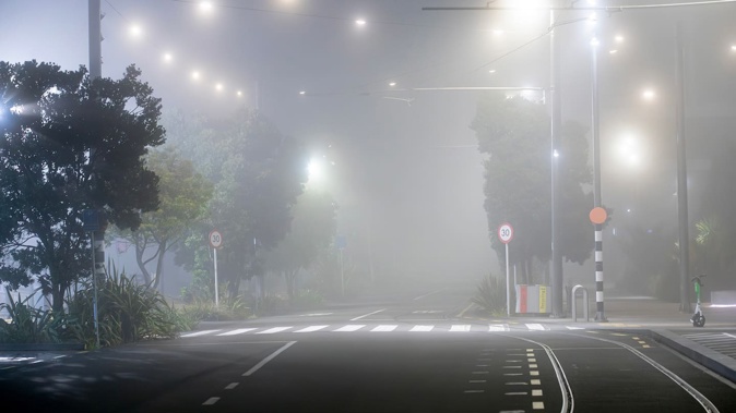 Thick fog is blanketing Auckland this morning. Photo / Hayden Woodward