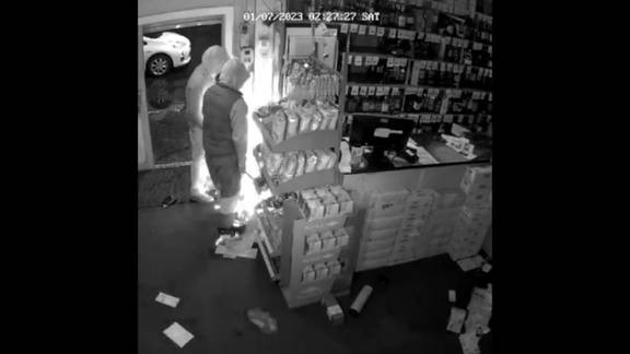 Teens use an angle grinder to break into a cigarette cabinet during the burglary of a Waikato bottle store in July. Image / Ash Parmar