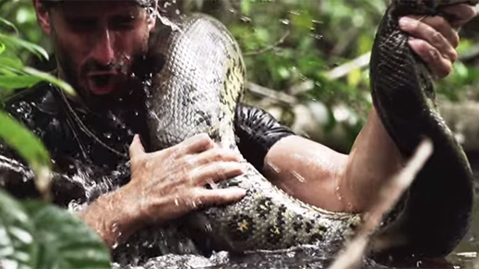 A promo shot for Eaten Alive, where an anaconda swallows Paul Rosolie (YouTube)