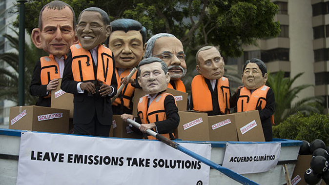 Activists depicting Australia's Prime Minister Tony Abbot (L), US President Barack Obama (2-L), China's President Xi Jinping (3-L), Canada's Prime Minister Stephen Harper (C), India's Prime Minister Narendra Modi (3-R), Rusia's President Vladimir Putin (2-R) and Japan's Prime Minister Shinzo Abe (R) demonstrate on the sidelines of the UN COP20 and CMP10 climate change conferences being held in Lima on December 12, 2014 (Getty Images)