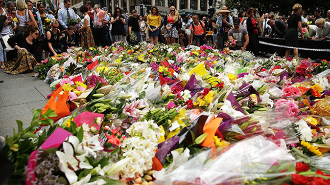 Flowers are left as a sign of respect at Martin Place on December 16, 2014 in Sydney, Australia. The siege in Sydney's Lindt Cafe in Martin Place is over after 16 hours (Getty Images)