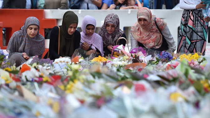 NSW Premier Mike Baird says a permanent Martin Place memorial will be erected when the time is right, as people continue to come together to mourn the Sydney cafe siege victims. (Getty Images)