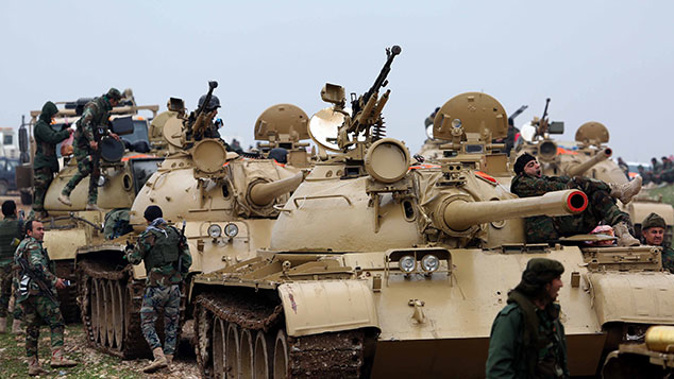 Peshmerga fighters departed from Zumar pass through Sinun district of Mosul, northern Iraq while shipping military ammunition including missiles, mortars and armored military vehicles in order to fight against ISIS in Sinjar (Getty)