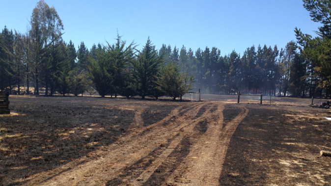 Fire-fighters are battling a large grass fire in the Canterbury town of Rolleston (Photo: Supplied)