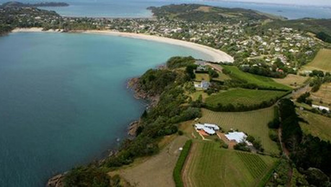 Police are investigating the discovery of human bones by a contractor digging under a water tank in a back yard on Waiheke Island (APN)