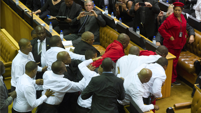 The altercation between security forces and Economic Freedom Fighter lawmakers (Getty Images)