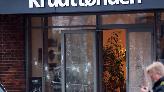 Bullet holes in the windows and doors of the cafe in Copenhagen (Getty Images)