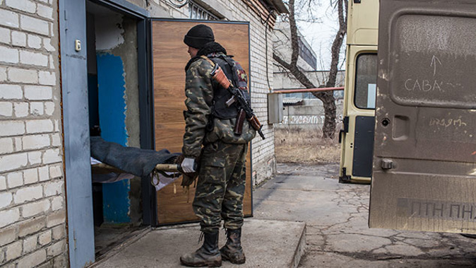 The body of a Ukrainian soldier killed in fighting is brought into the morgue on February 14, 2015 in Artemivsk, Ukraine. (Getty Images)
