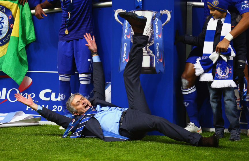 Manager Jose Mourinho of Chelsea on the pitch as Chelsea celebrate with the trophy during the Capital One Cup Final match between Chelsea and Tottenham Hotspur.