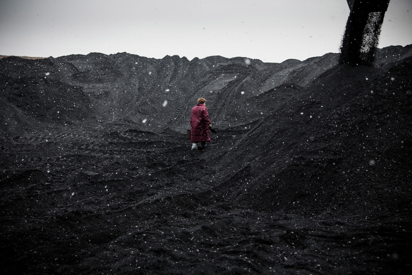 A quality control specialist collects samples of coal Holodnaya Balka mine on March 3, 2015 in Makeevka, Ukraine.