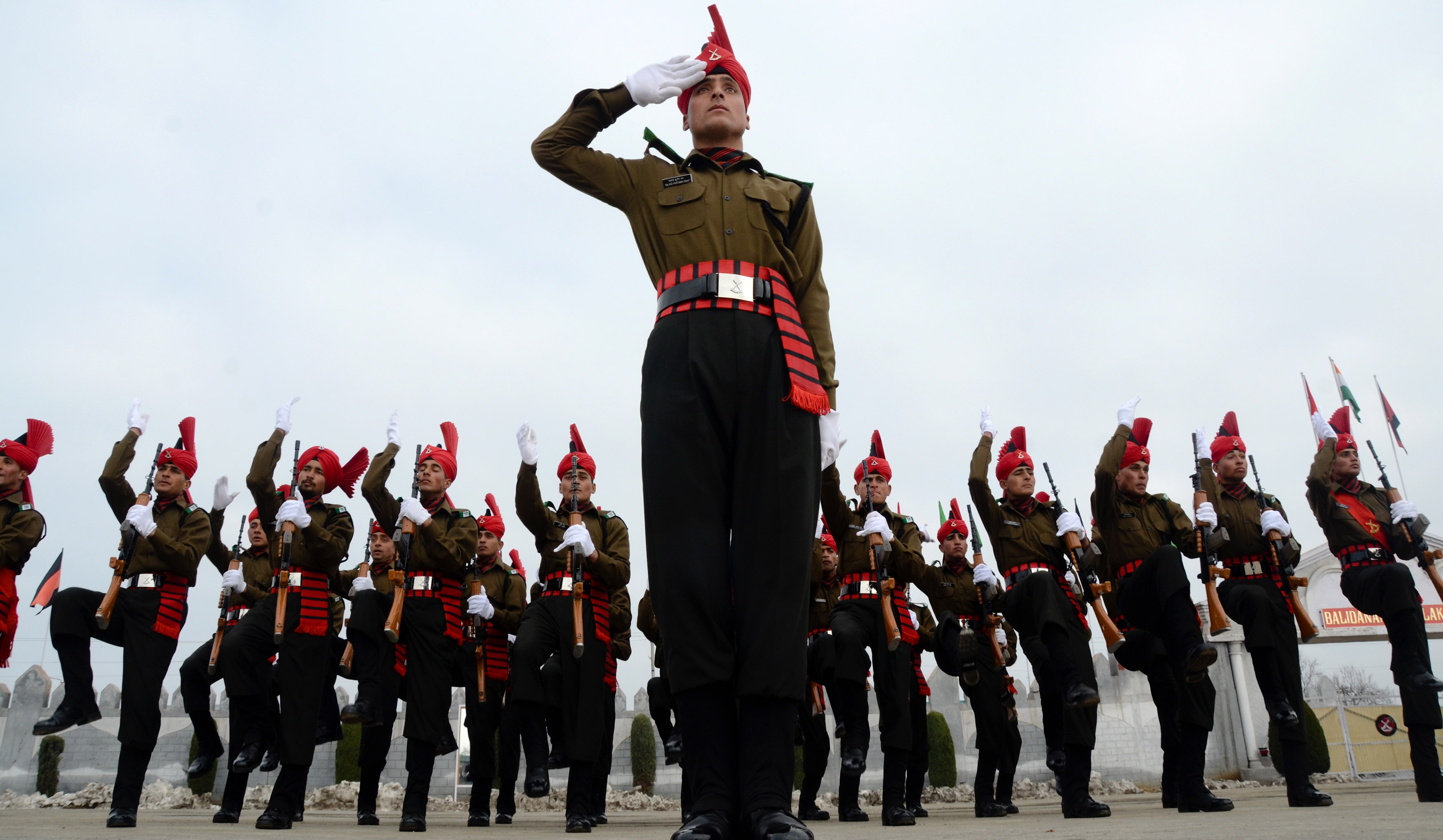 Recruits of Indian army from Kashmir salute during their passing out parade at a garrison in Rangreth on March 04, 2015 in the outskirts of Srinagar, the summer capital of Indian-administered Kashmir, India.