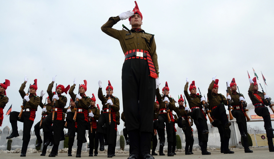 Recruits of Indian army from Kashmir salute during their passing out parade at a garrison in Rangreth on March 04, 2015 in the outskirts of Srinagar, the summer capital of Indian-administered Kashmir, India.