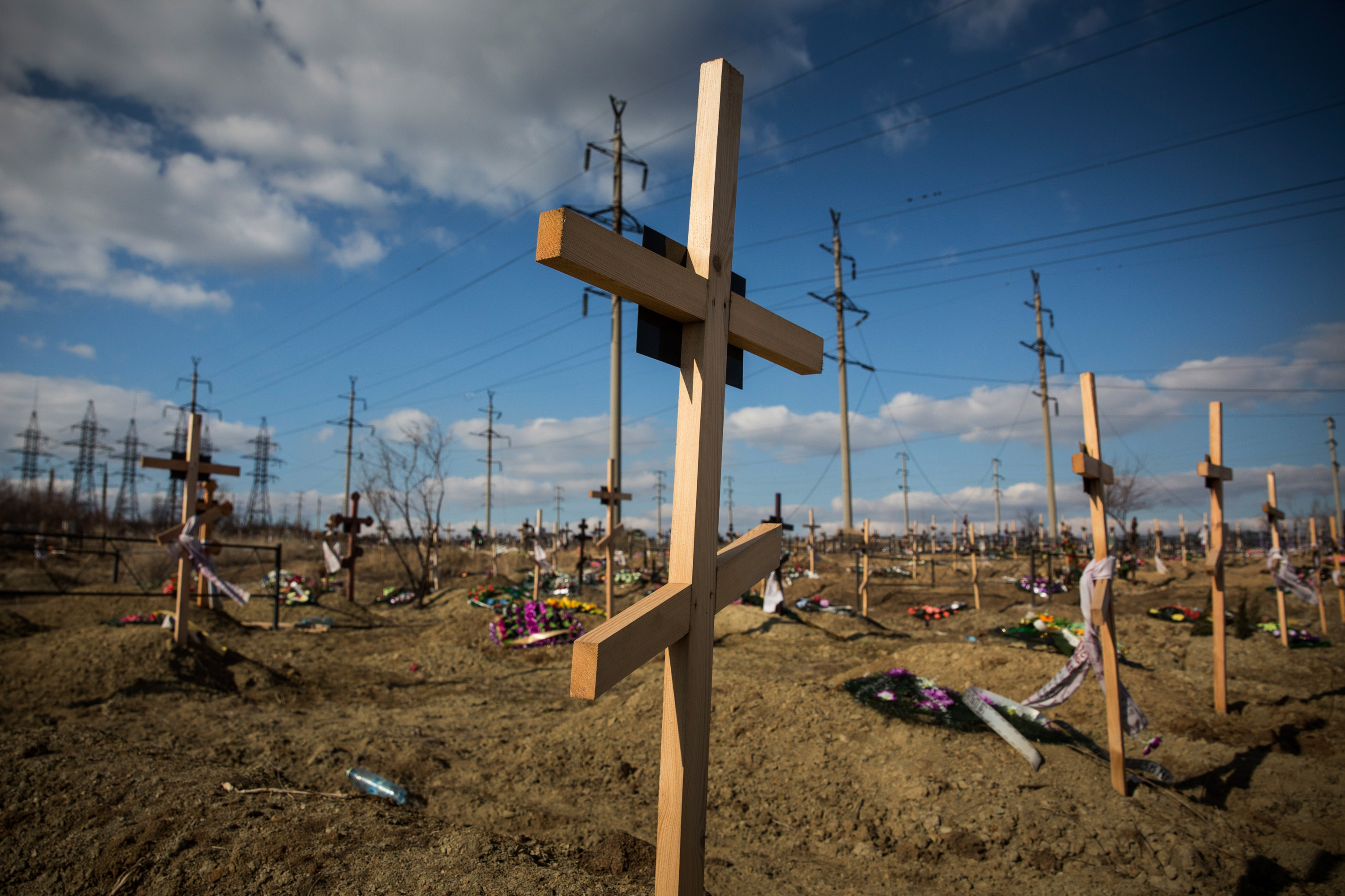 Fresh graves, many of which have been created due to the ongoing conflict between Ukraine and pro-Russian rebels, sit on a hillside in Donetsk, Ukraine.
