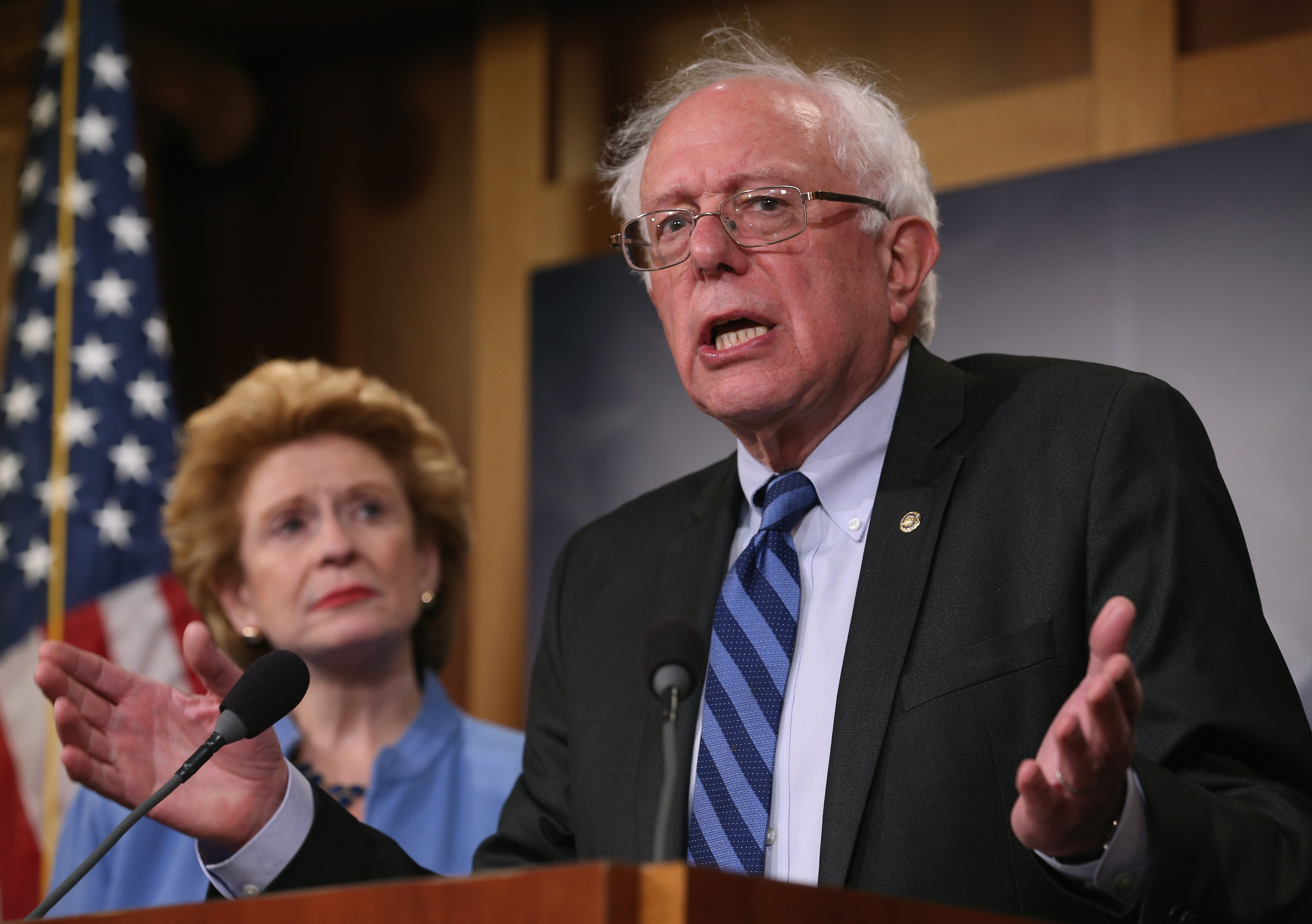 Senate Budget Committee ranking member Bernie Sanders (I-VT) speaks about ending sequestration while flanked by Sen. Debbie Stabenow (D-MI), during a news conference on Capitol Hill.