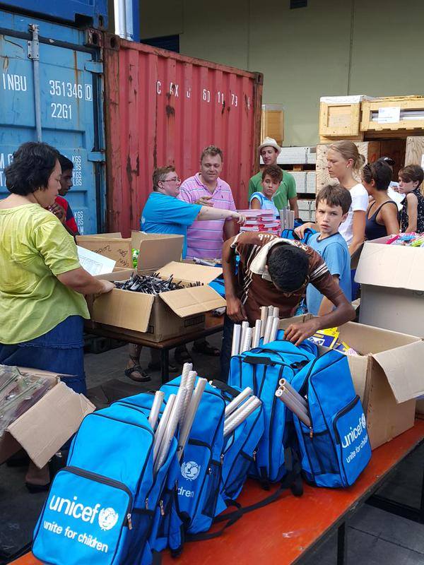 UNICEF on the ground handing out care packages.