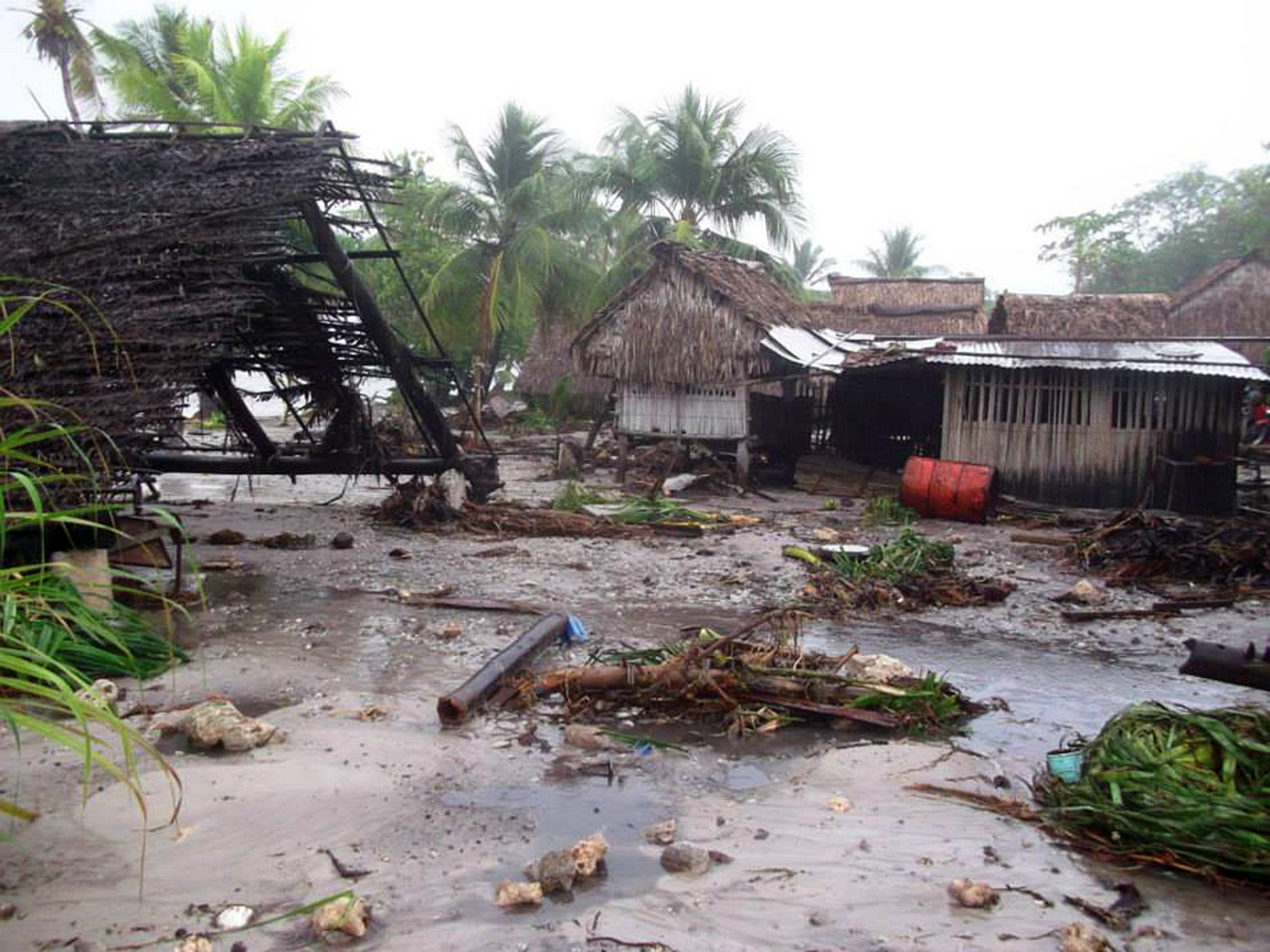 Storm damaged houses in Kiribati.