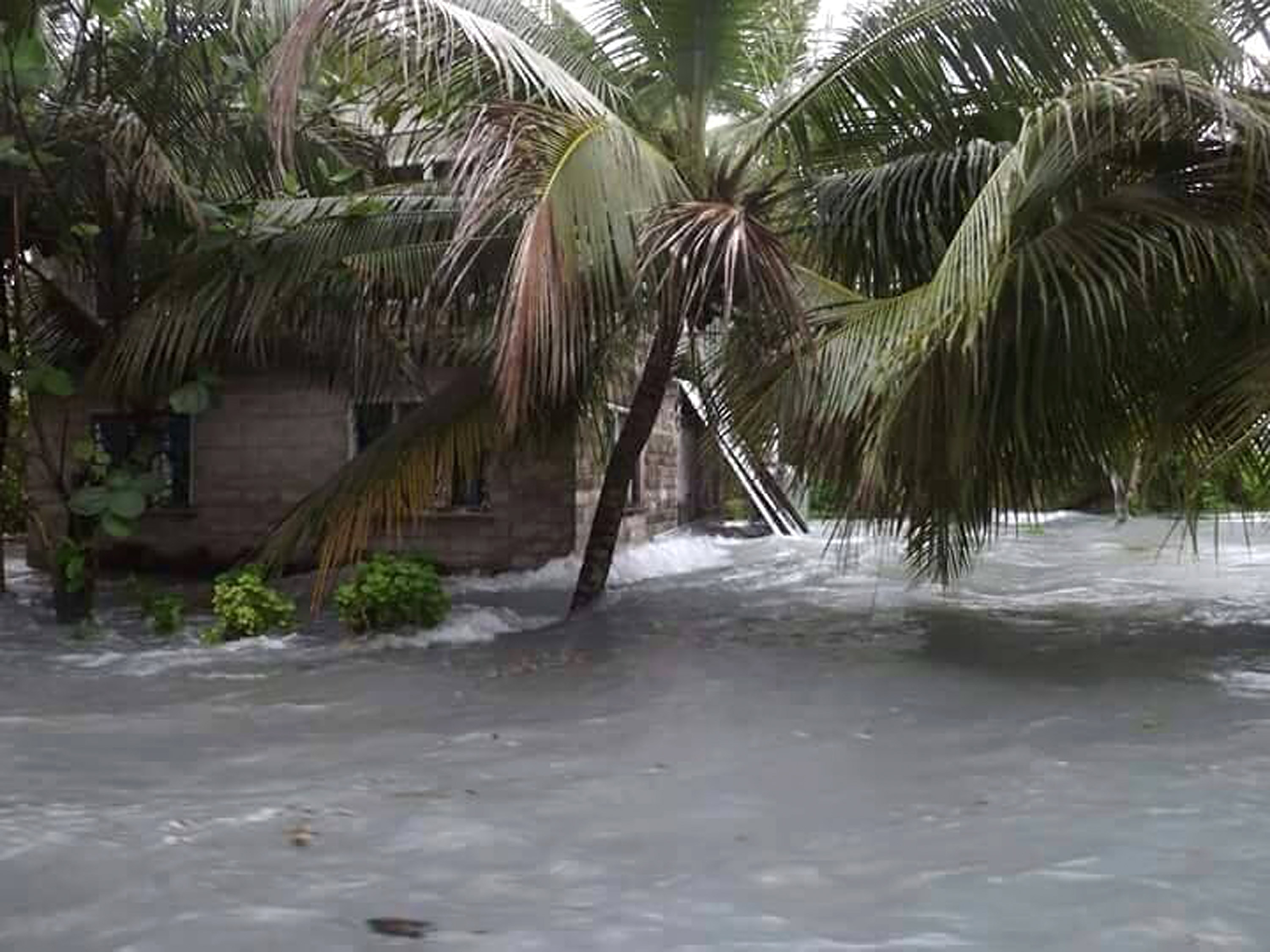 Flood water moves inland in Tuvalu.
