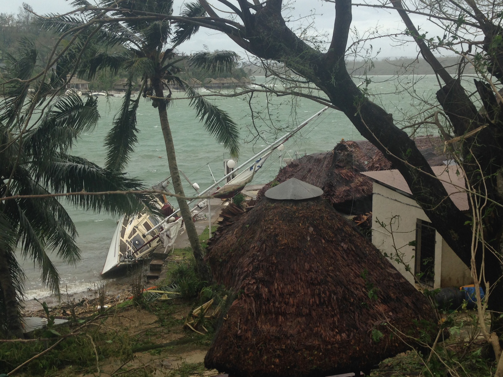 Damaged huts on the island of Vanuatu.