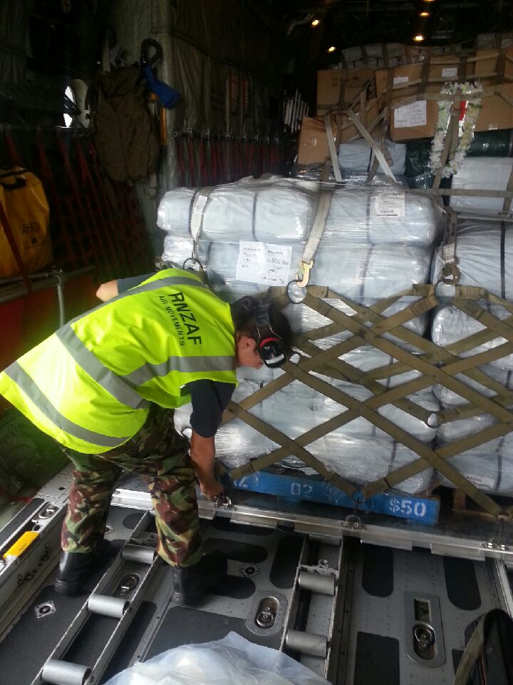 RNZAF workers solidify packages destined for Vanuatu.