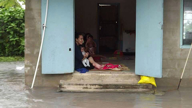 A woman takes shelter in Tuvalu. 