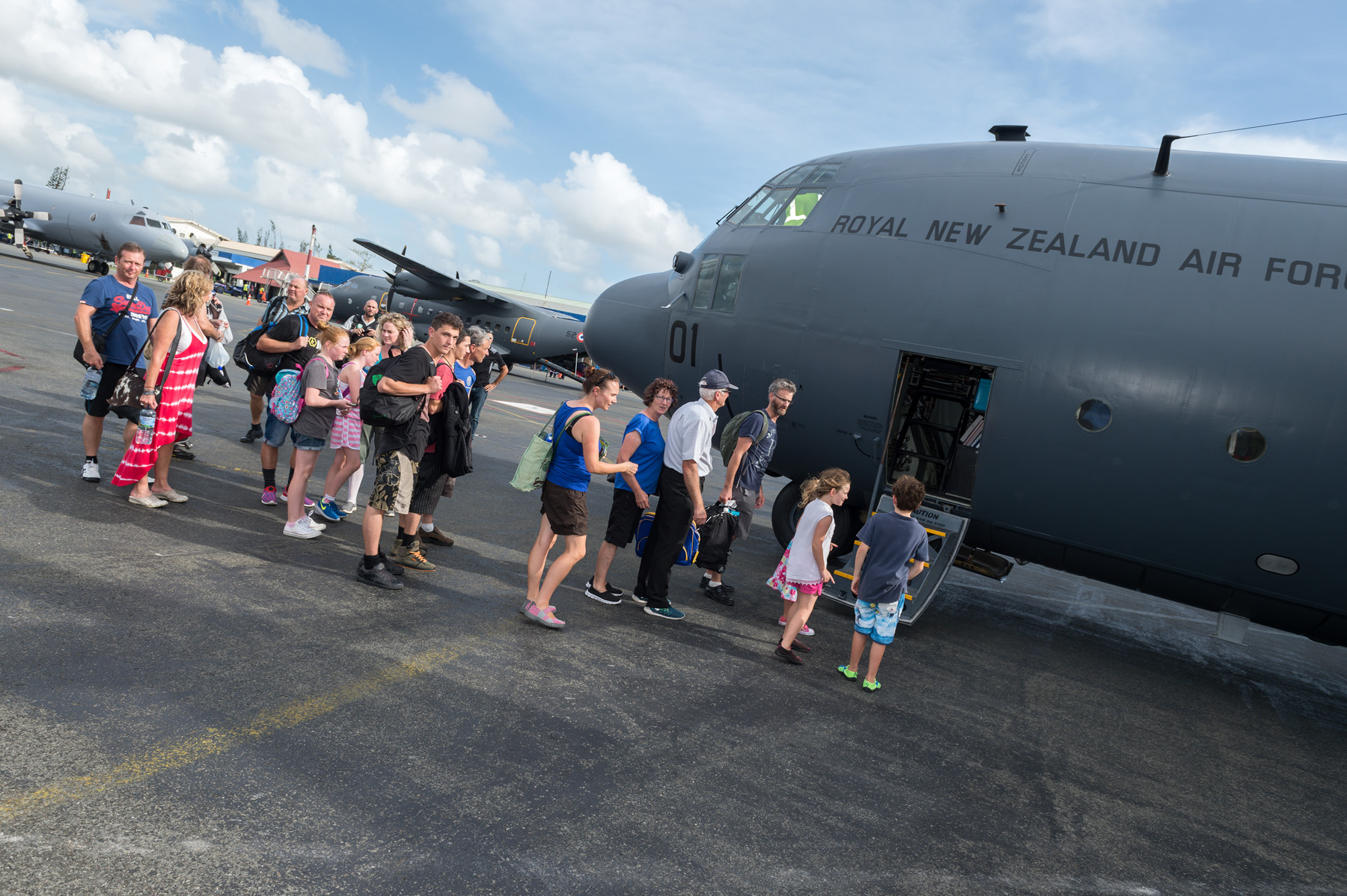 New Zealanders boarding an Air Force flight out of Vanuatu. 