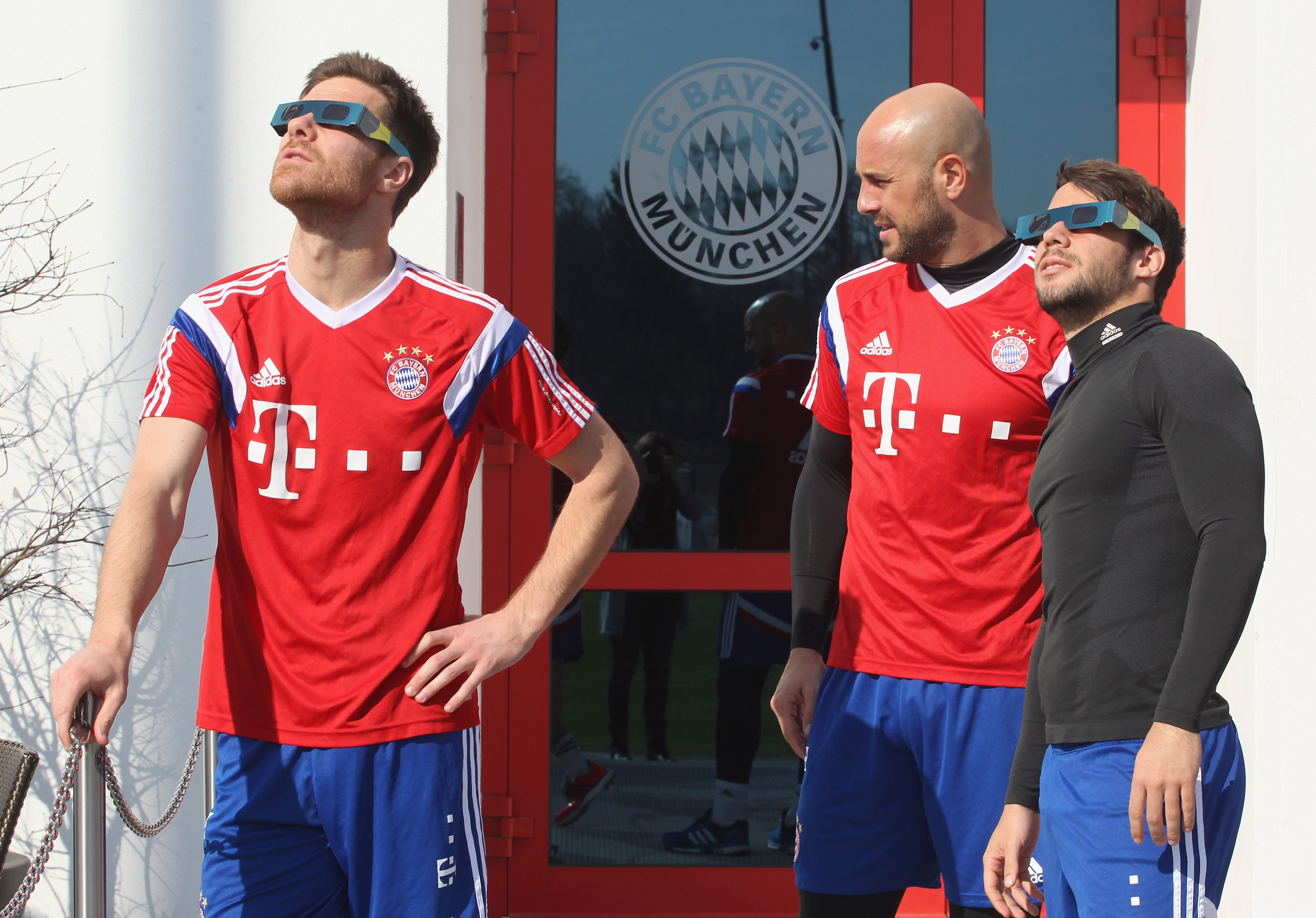 Bayern Munich players check out the solar eclipse during training.