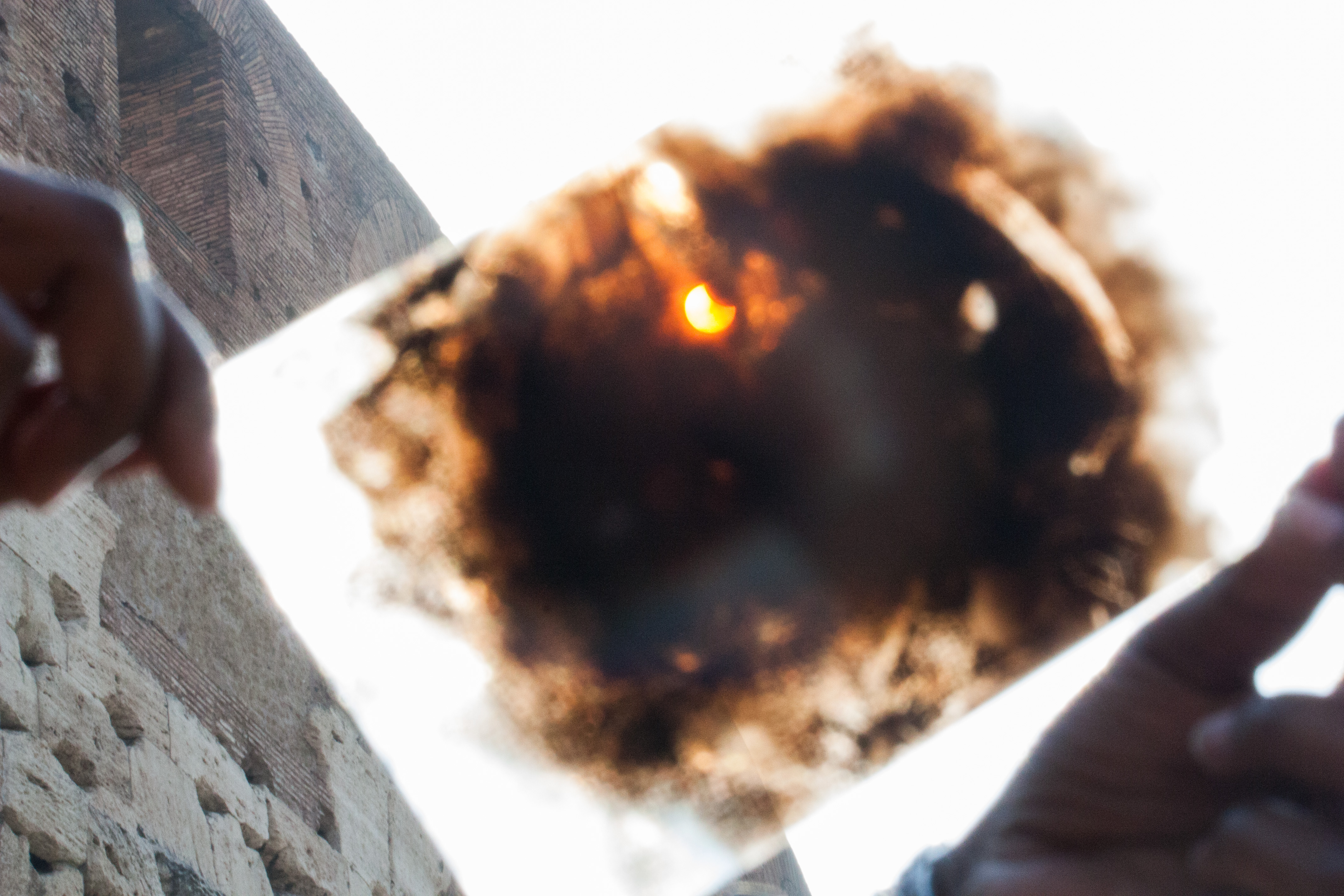 A view of the solar eclipse as seen in Rome through the viewing paper.