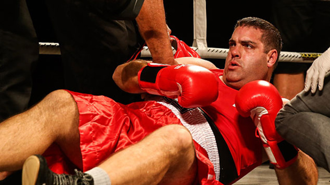 Cameron Slater reacts after being knocked out by Jesse Ryder (Getty Images)