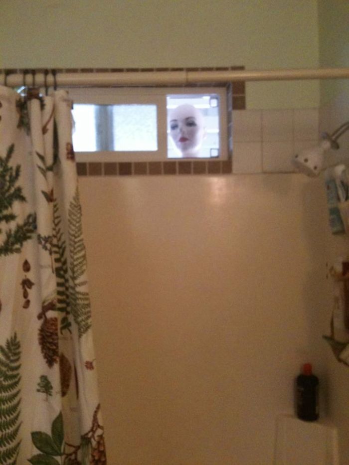 Mannequin outside the window.