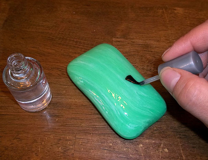 Put nail polish on the shower soap and wait for the magic..