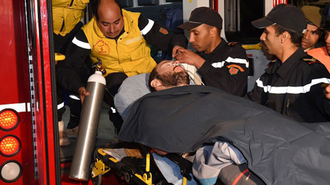 Moroccan rescue workers carry a rescued Spanish caver (Getty Images)