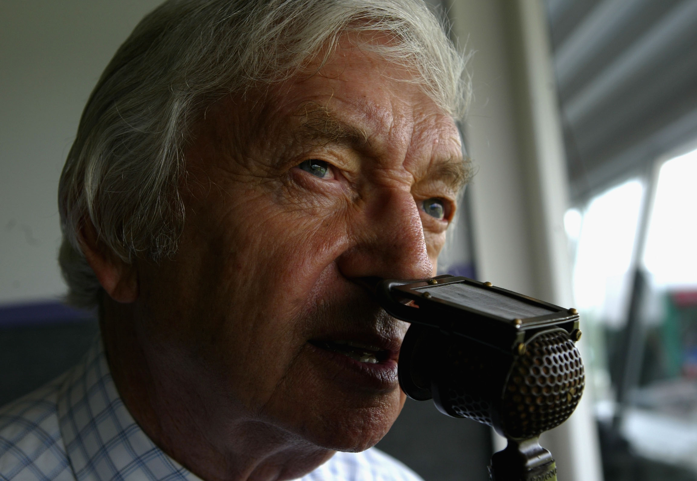 Channel 4 commentator Richie Benaud commentates during day 2 of the 3rd npower test match between England and the West Indies at Old Trafford (2004)