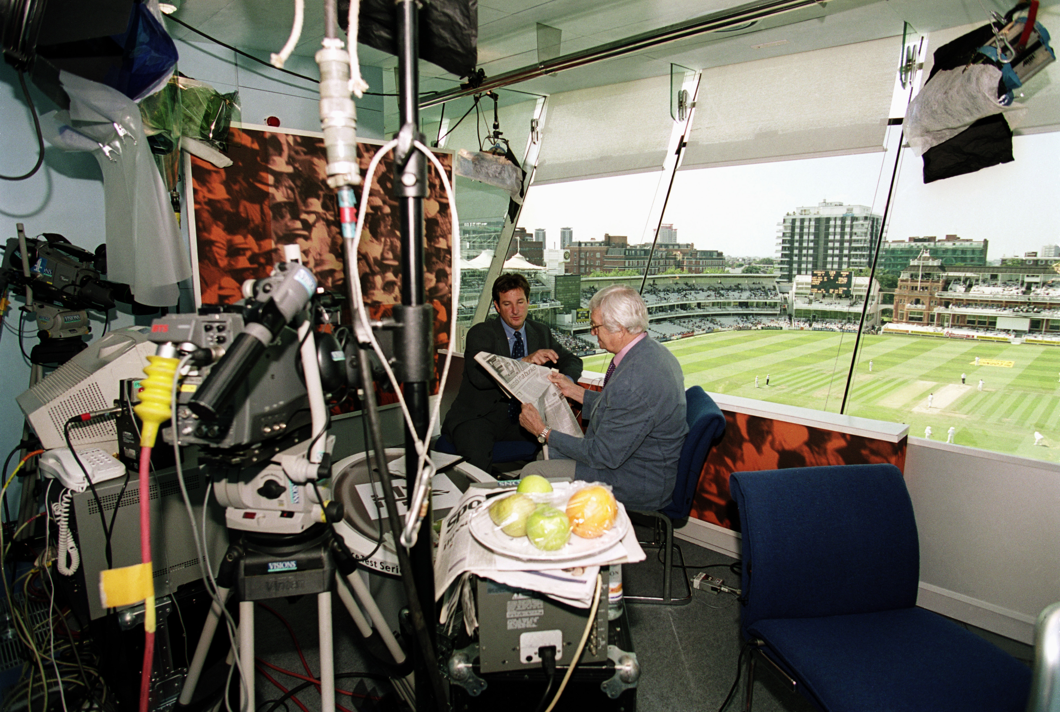 Channel 4 television presenters Mark Nicholas and Richie Benaud in discussion on air during the Second Test match between England and New Zealand (1999)