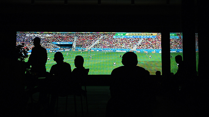 Gamblers watching a football match in China (Getty Images) 