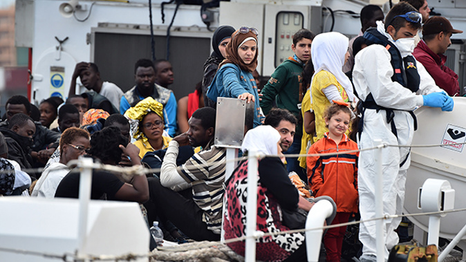 A refugee boat arriving in Palermo, Italy (Getty Images) 