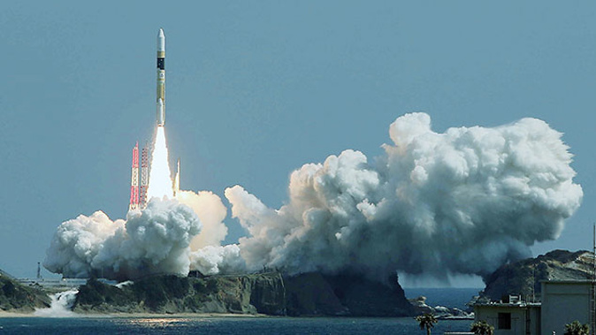 Japan's H-2A rocket carrying an information-gathering satellite lifts off from the launching pad at the Tanegashima Space Center in Tanegashima island, Kagoshima prefecture on March 26, 2015 (Getty Images) 
