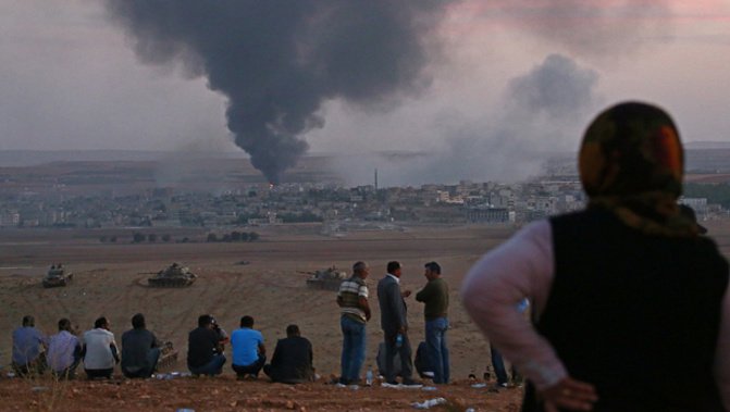 Smoke rises from a bombing in Kobane, Syria (Getty Images) 