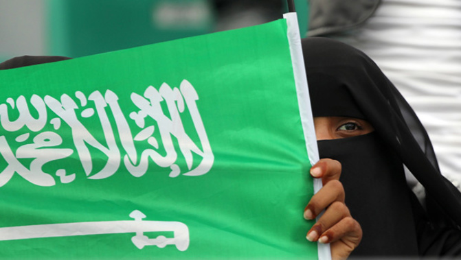 A Saudi Arabian woman holding the flag (Getty Images) 
