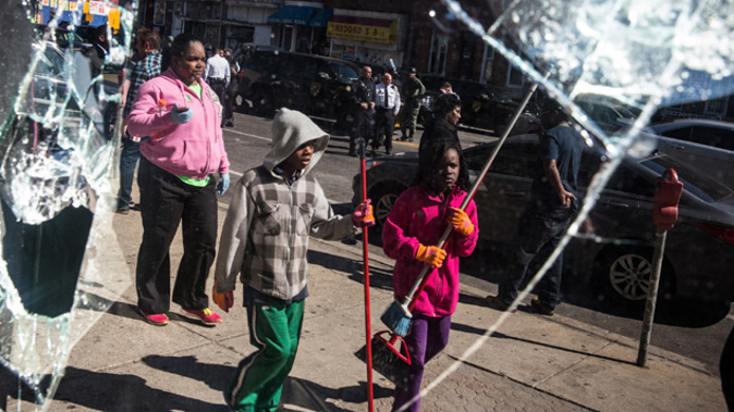 Children helping with the clean up in Baltimore (Getty Images) 