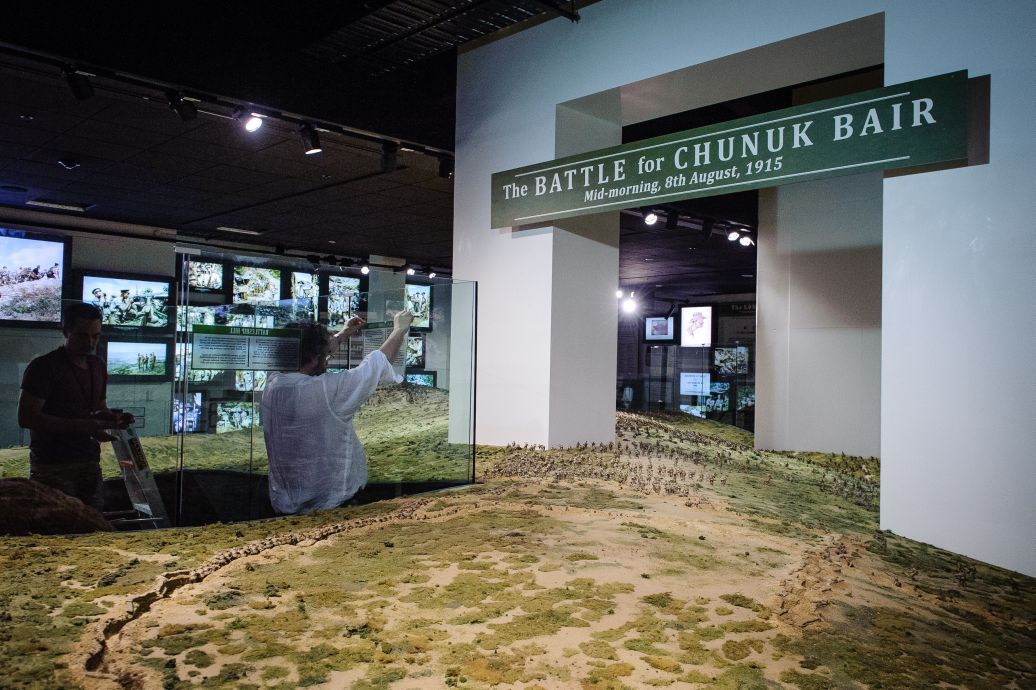 Sir Peter Jackson helps put the final touches on the Battle for Cunuk Bair display prior the public opening of the new space. WELLINGTON, NEW ZEALAND - May 04: Opening of "Gallipoli: the New Zealand Story in Colour"  Great War Exhibition, Pukeahu National War Memorial, Buckle St, Wellington May 04, 2015 in Wellington, New Zealand. (Photo by Mark Tantrum/ mark tantrum.com)