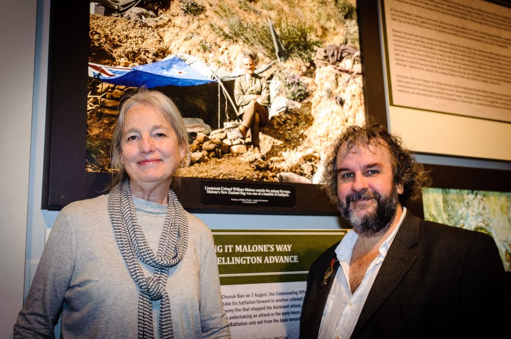 Anita Young and Sir Peter Jackson in front of a photograph of Lieutenant Colonel William Malone at the front lines. WELLINGTON, NEW ZEALAND - May 04: Opening of "Gallipoli: the New Zealand Story in Colour"  Great War Exhibition, Pukeahu National War Memorial, Buckle St, Wellington May 04, 2015 in Wellington, New Zealand. (Photo by Mark Tantrum/ mark tantrum.com