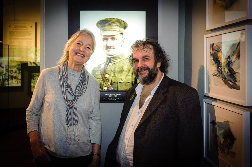 UK based Artist Anita Young and Sir Peter Jackson in front of a portrait of Anita's Grandfather Lieutenant Colonel William Malone. WELLINGTON, NEW ZEALAND - May 04: Opening of "Gallipoli: the New Zealand Story in Colour"  Great War Exhibition, Pukeahu National War Memorial, Buckle St, Wellington May 04, 2015 in Wellington, New Zealand. (Photo by Mark Tantrum/ mark tantrum.com)
