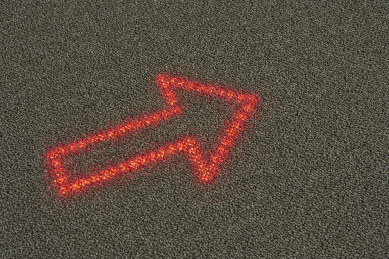 Philips and Desso have only mentioned that it will involve a layer of LEDs beneath a special light transmissive carpet, giving it the appearance of an ordinary carpet until it's lit.