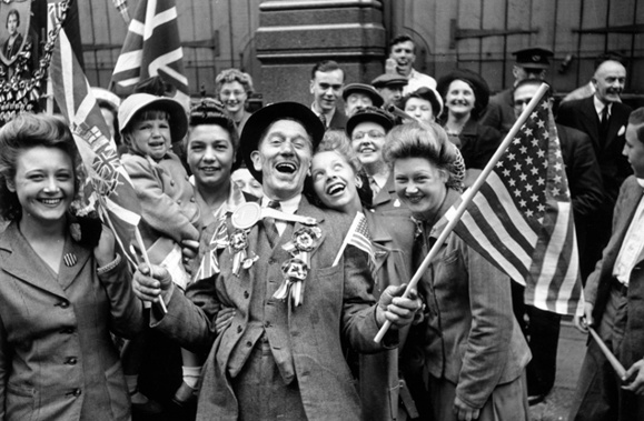 (Ecstatic crowds celebrating VE Day in London's Piccadilly, at the end of World War II: Getty Images)