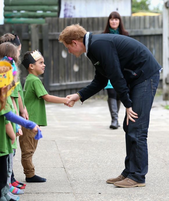 Prince Harry shakes hands with pupils at Halfmoon Bay School in Oban as he leaves / Photo: Getty Images